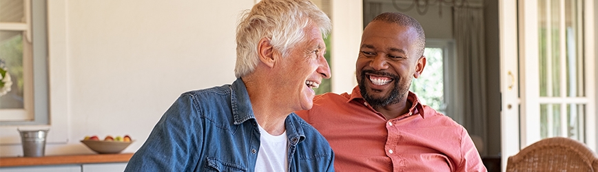 Two men laughing together